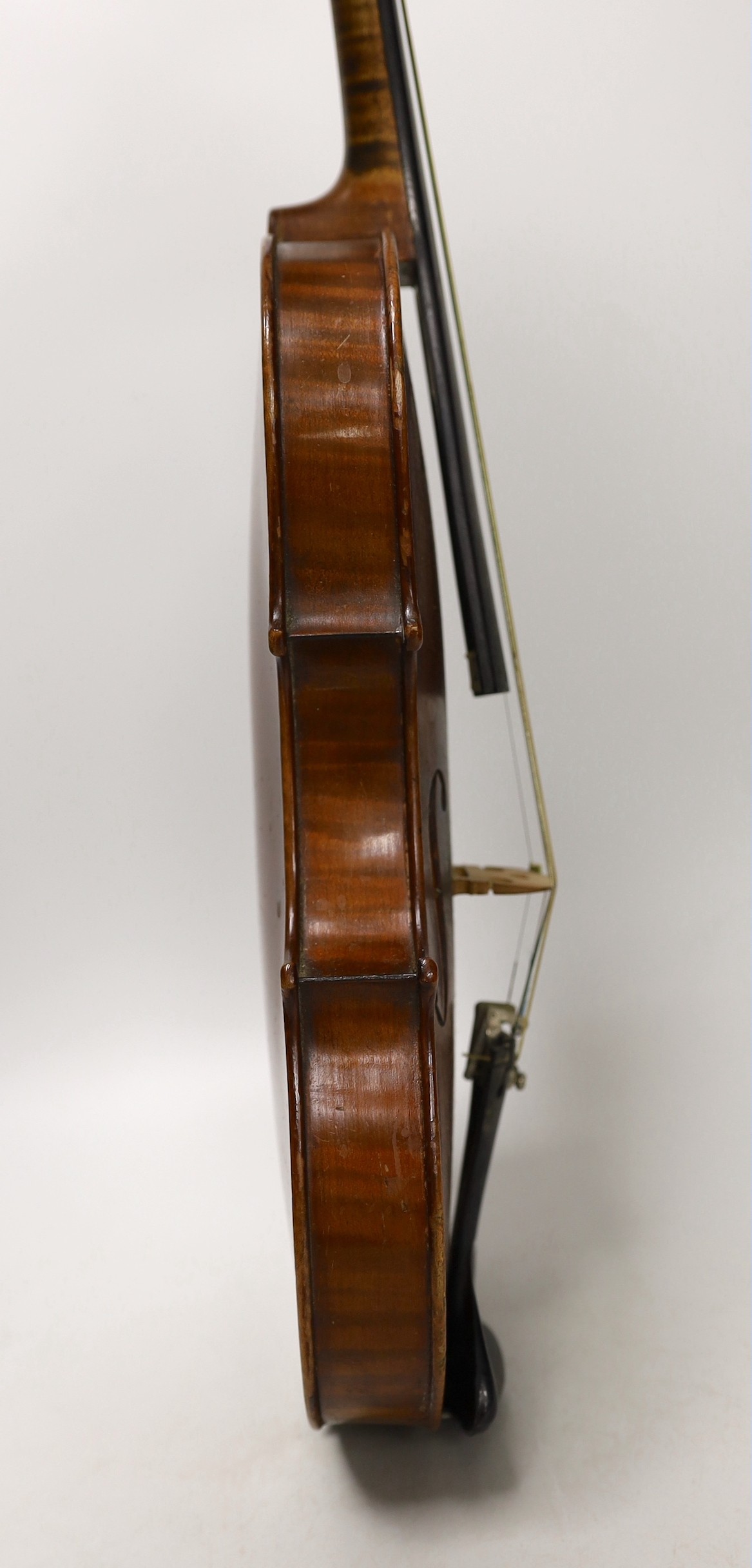 A cased French double backed violin, interior label reads ‘Copie de J.B. Vuillaume à Paris.’ Back measures 36cm excluding button
